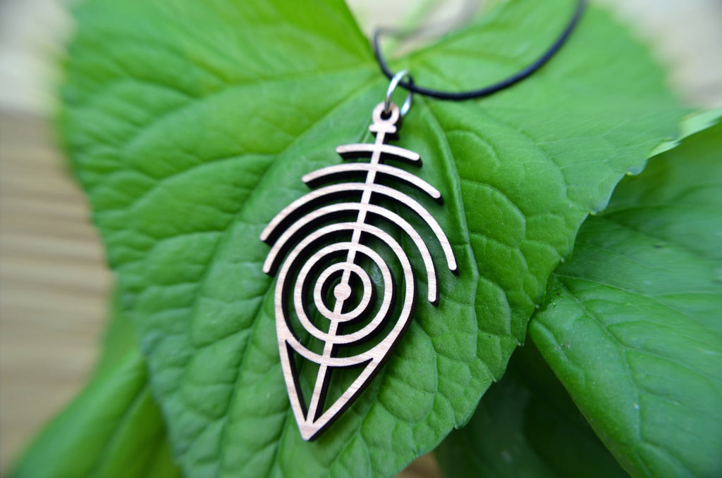 Primitive Pendant in cherry on leather cord