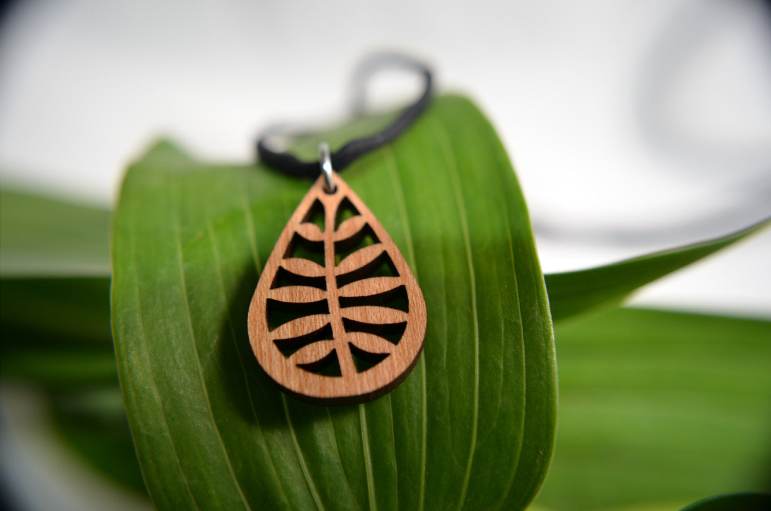 Leafy Pendant in cherry on leather cord